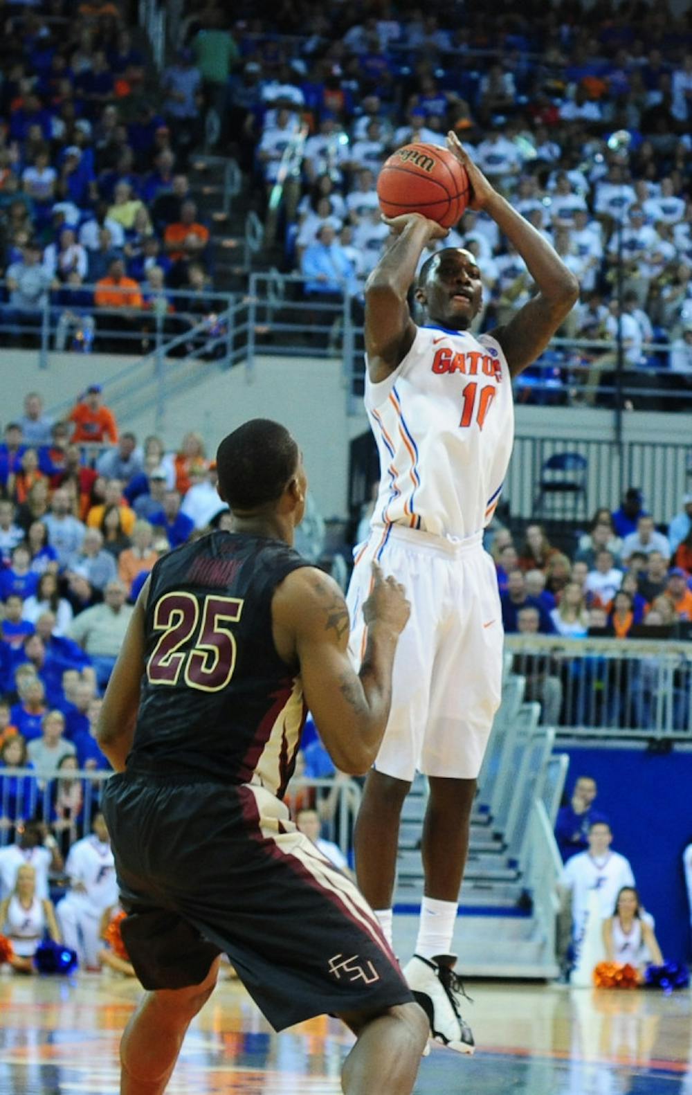 <p>Redshirt sophomore forward Dorian Finney-Smith shoots a jumper during No. 15 Florida's 67-66 win against Florida State on Friday night in the O'Connell Center.</p>