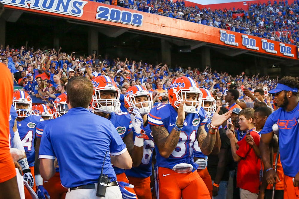 <p>Jalen Tabor (31) claps before walking out of the tunnel at Ben Hill Griffin Stadium during Florida's 33-0 win over North Texas on Sept. 17, 2016.</p>