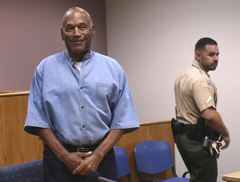 <div>O.J. Simpson smiles during his parole hearing in Nevada&nbsp;on Thursday. Simpson was granted parole and is set to be released from jail on&nbsp;Oct. 1.</div>
