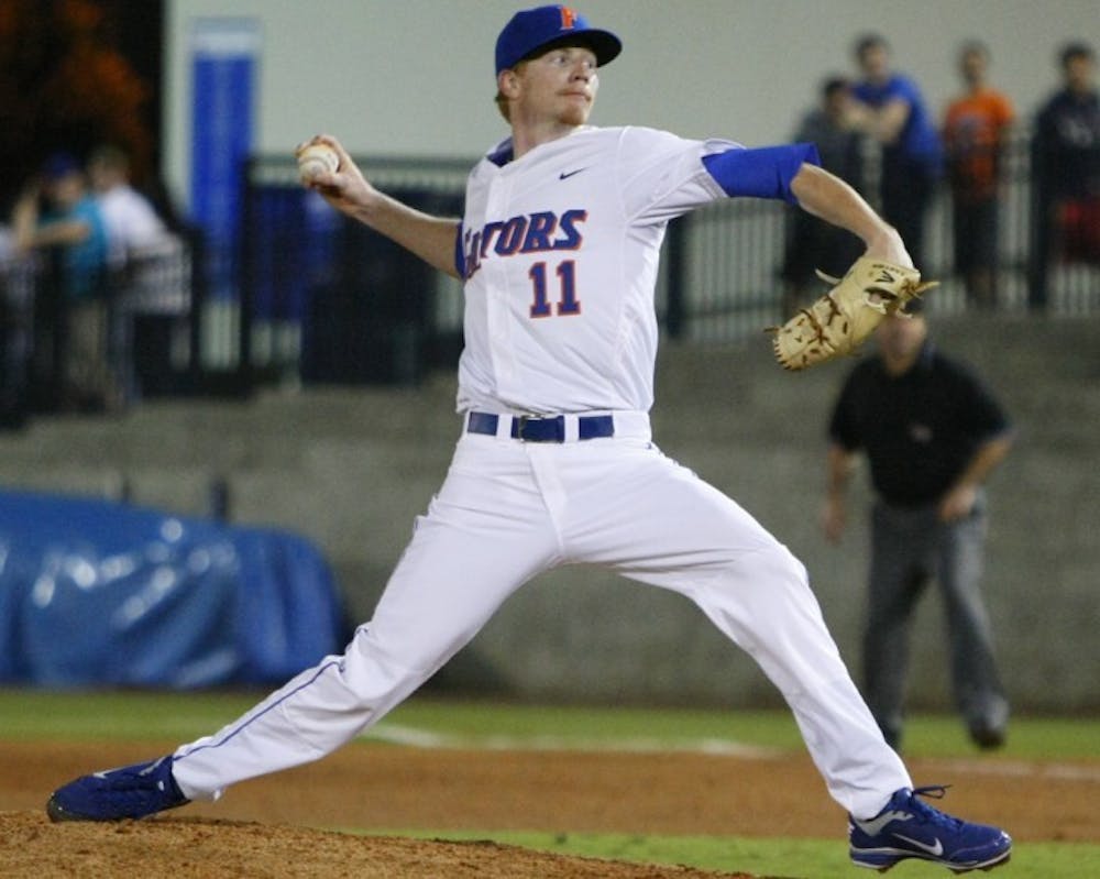 <p>Florida right-handed starting pitcher Hudson Randall throws against William and Mary on Feb. 24. Randall did not throw last weekend due to a “tired arm,” and his status is unknown for this weekend.</p>