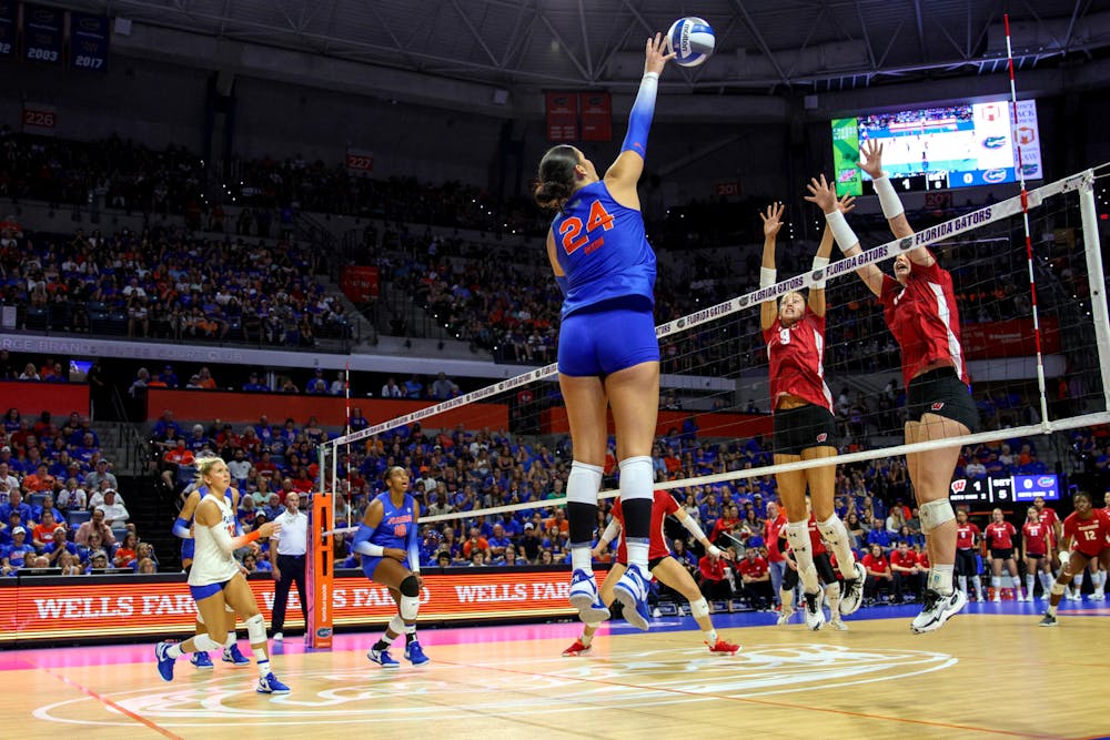 Graduate student outside hitter Anna Dixon hits the ball in the Gators' 3-2 loss against the Wisconsin Badgers Sunday, Sept. 17, 2023.