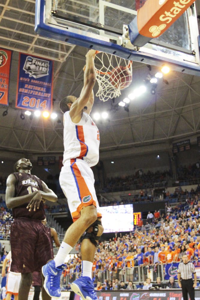 Jon Horford dunks during Florida's overtime win against Louisiana Monroe