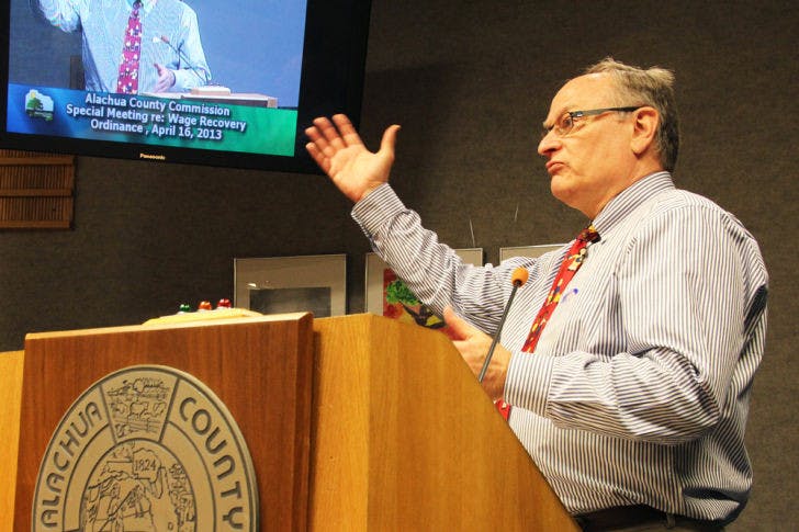 Samuel Mutch, a Gainesville attorney at law, addressed the Alachua County Commission on Tuesday night regarding the wage recovery ordinance. The ordinance passed 3-2.