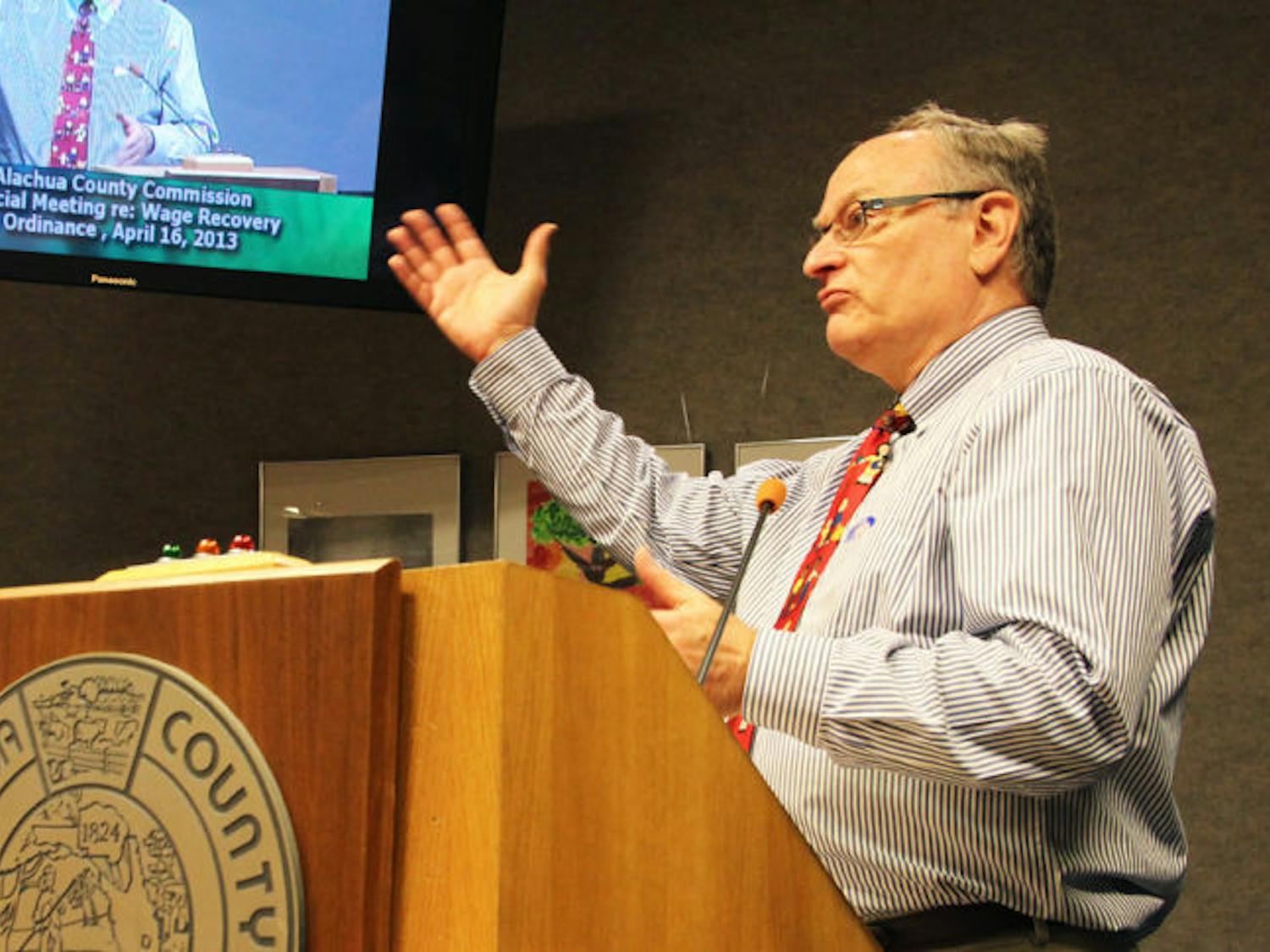 Samuel Mutch, a Gainesville attorney at law, addressed the Alachua County Commission on Tuesday night regarding the wage recovery ordinance. The ordinance passed 3-2.