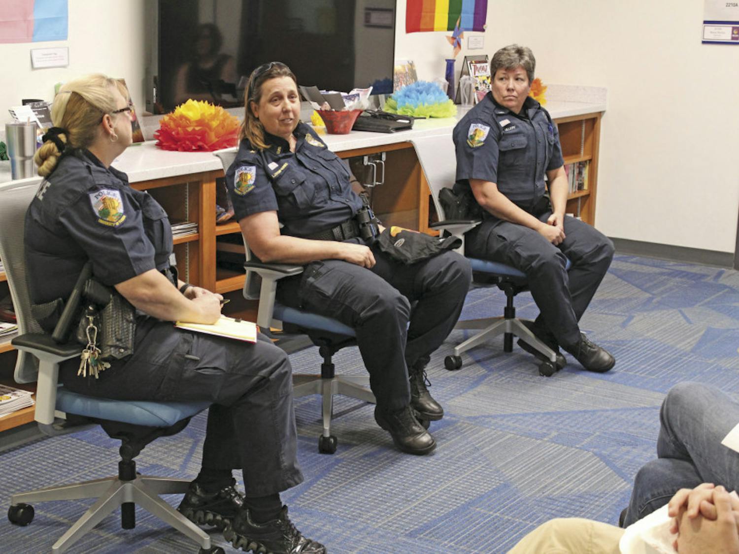 Officers Susan Pratt and Diana Ullery flank Chief Linda Stump-Kurnick as she answers a question at the University Police’s town hall in UF’s Rainbow Suite on Tuesday, February 7, 2017. The officers were there to answer questions from the students, but several students attended only to disrupt the event, interrupting with phrases such as, “Lay with pigs, wake up dirty.”