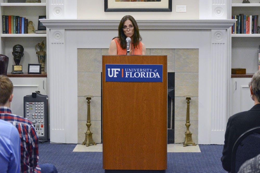 <p>Maria Coady, a UF education associate professor, presents the Thomas J. Coady Memorial Scholarship, which will award part of a $30,000 endowment every spring to a UF junior or senior studying health disparity, in memory of her son, Thomas Coady, in Emerson Hall on Monday. “Thomas was my inspiration,” she said. “My voice of reason and my teacher.”</p>
<p><em>Correction: The original caption stated that scholarship recipients receive the entire endowment, when really they just receive part of it.&nbsp;</em></p>