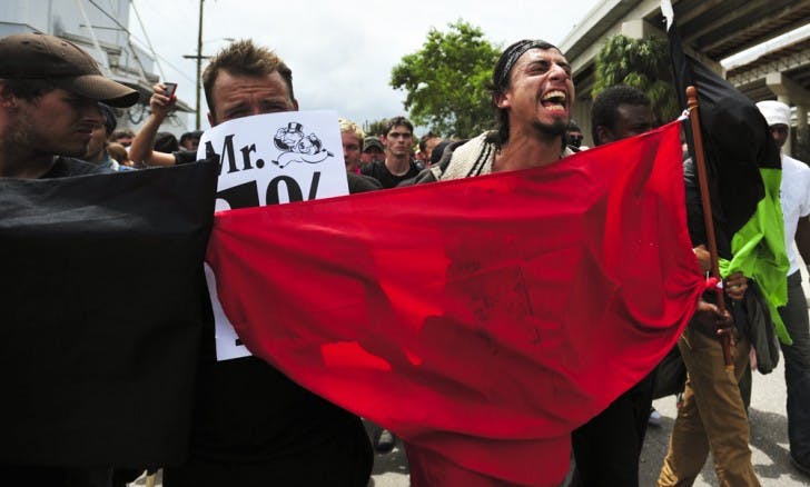 Demonstrators march on the streets of downtown Tampa, Fla., on Monday in protest of the Republican National Convention.