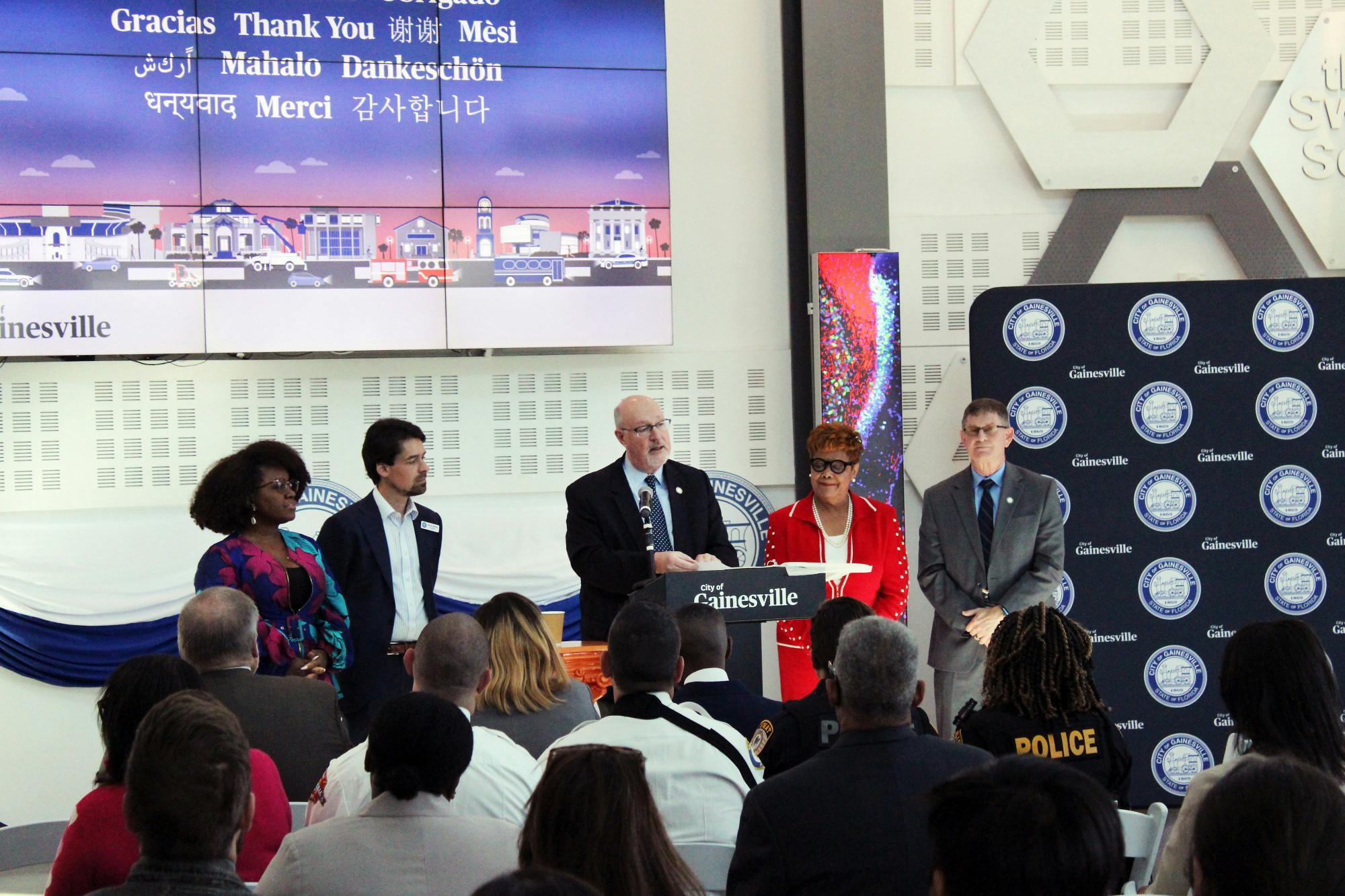 Gainesville Mayor Harvey Ward (center) delivers the State of the City address at the Cade Museum while accompanied by the rest of the City Commission members onstage Tuesday, Feb. 14, 2023. 