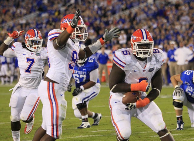 Florida defensive tackle Jaye Howard (6) caught a fumble by Kentucky quarterback Morgan Newton and scored a touchdown in the second quarter of a 48-10 win in Lexington, Ky., on Saturday.