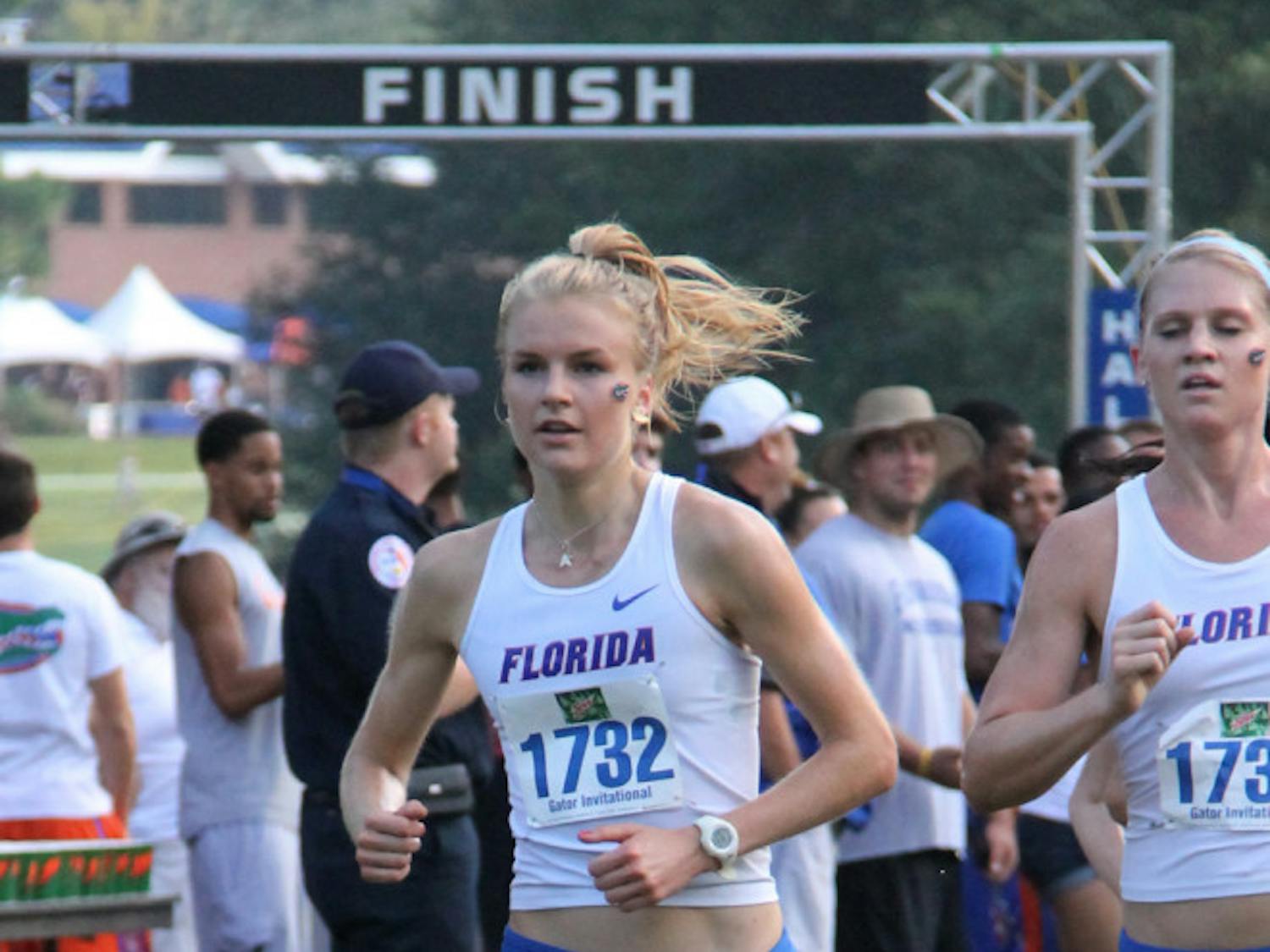 Senior Agata Strausa (left) races at the Mountain Dew Invitational on Sept. 14 in Gainesville. 