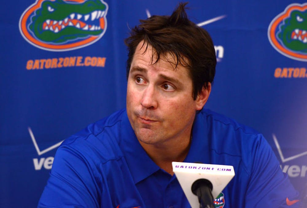 <p>Will Muschamp speaks at a postgame press conference following Florida’s 21-16 loss to Miami on Saturday in Sun Life Stadium. Florida dropped to No. 18 in the Associated Press Poll following the defeat, while Miami moved into the rankings at No. 15 with its first win against a top-10 team since 2009.</p>