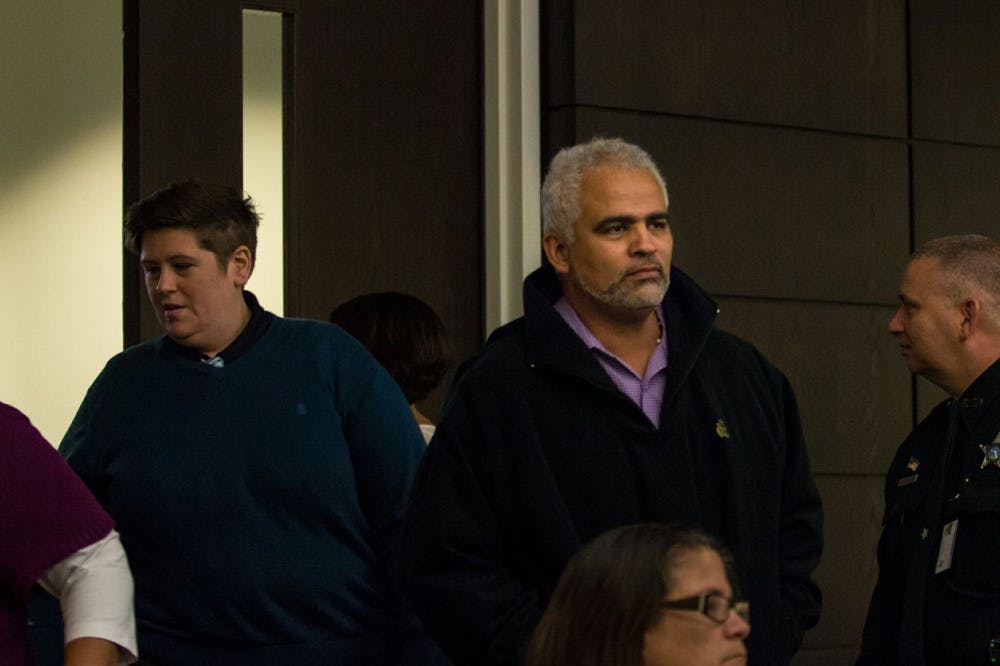 Carlos Aguilar enters the courtroom Monday.