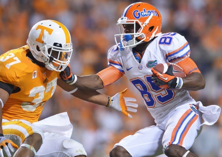 Receiver Frankie Hammond Jr. (85) shoves aside a defender on his way to scoring a career-long 75-yard touchdown at Neyland Stadium.&nbsp;