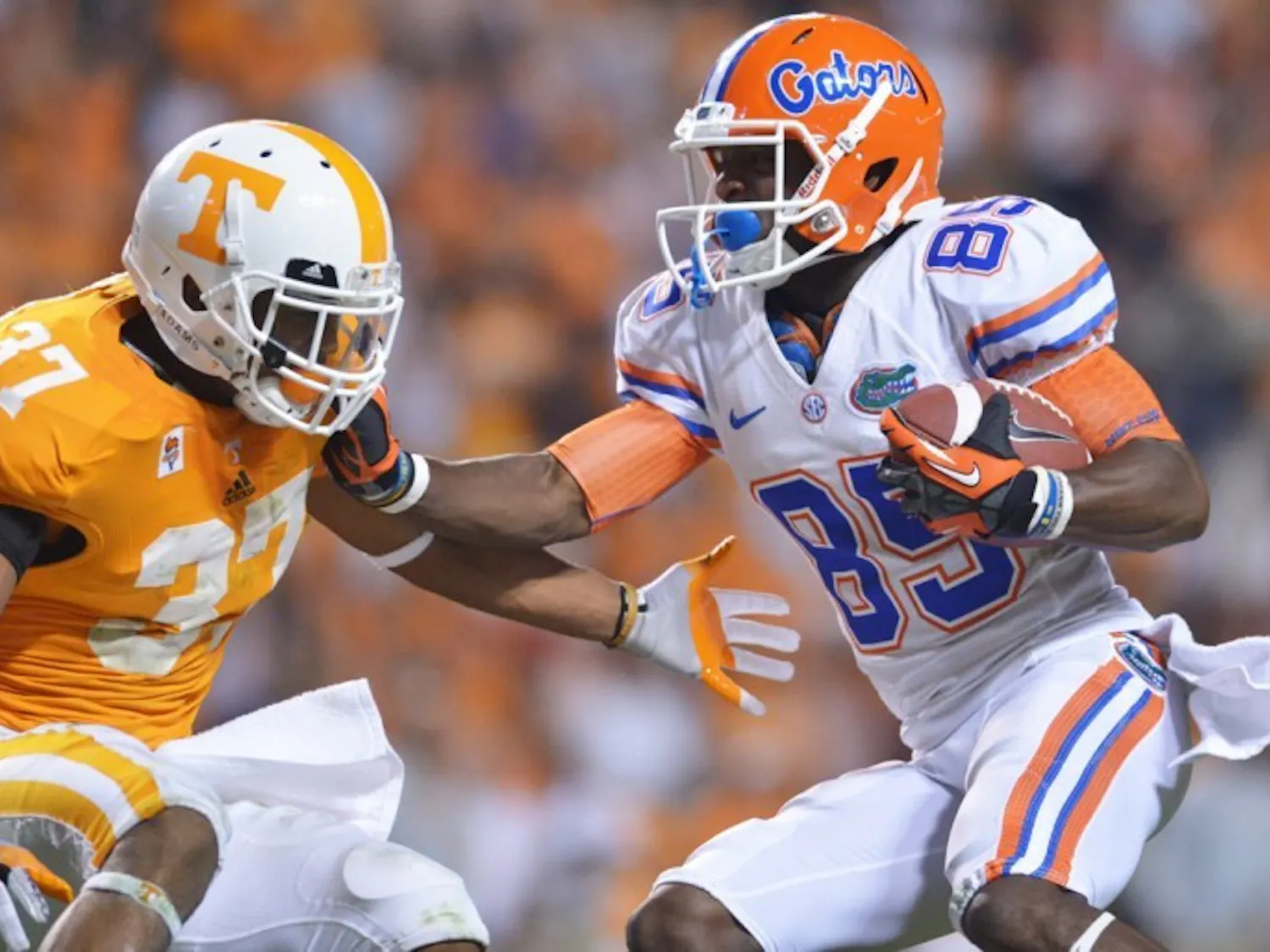 Receiver Frankie Hammond Jr. (85) shoves aside a defender on his way to scoring a career-long 75-yard touchdown at Neyland Stadium. 