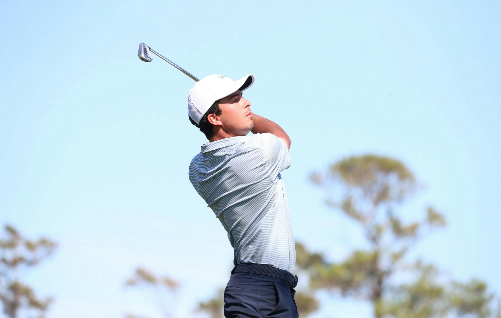 Senior Fred Biondi follows through on his swing at the Sea Best Invitational Monday, Jan. 30, 2023.