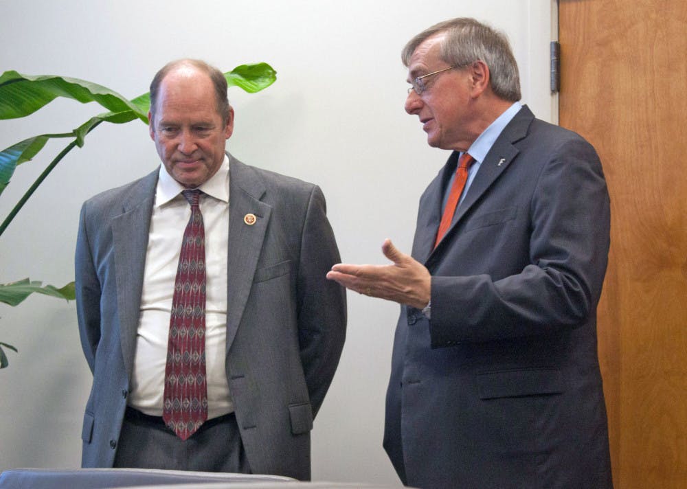 Congressman Ted Yoho and UF President Kent Fuchs discuss the process of the National Science Foundation conference before it begins. Fuchs invited Yoho to visit UF on Friday.