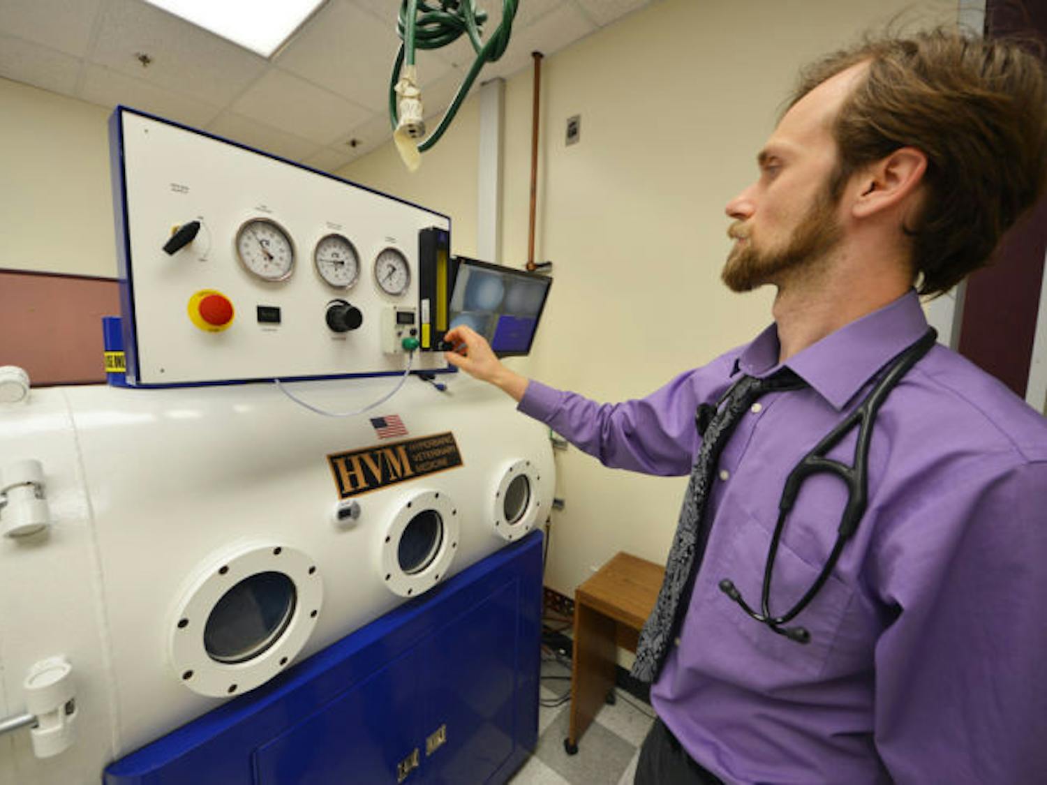 UF clinical assistant professor of integrative medicine Justin Shmalberg demonstrates how the hyperbaric chamber works at UF’s Small Animal Hospital on March 11.