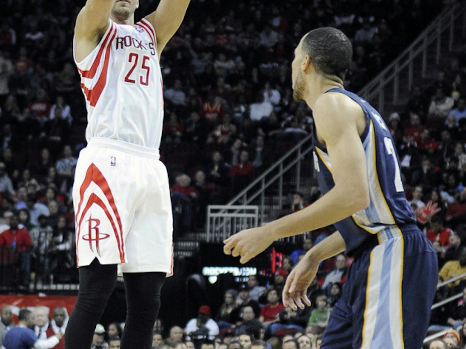 Houston Rockets’ Chandler Parsons (25) shoots a three-point shot as Memphis Grizzlies’ Tayshaun Prince watches on Jan. 24 in Houston.