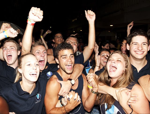 Unite Party members celebrate an election victory Thursday morning. The Unite Party won 46 of 50 contested seats. The Students Party took three seats and an independent student won one seat.