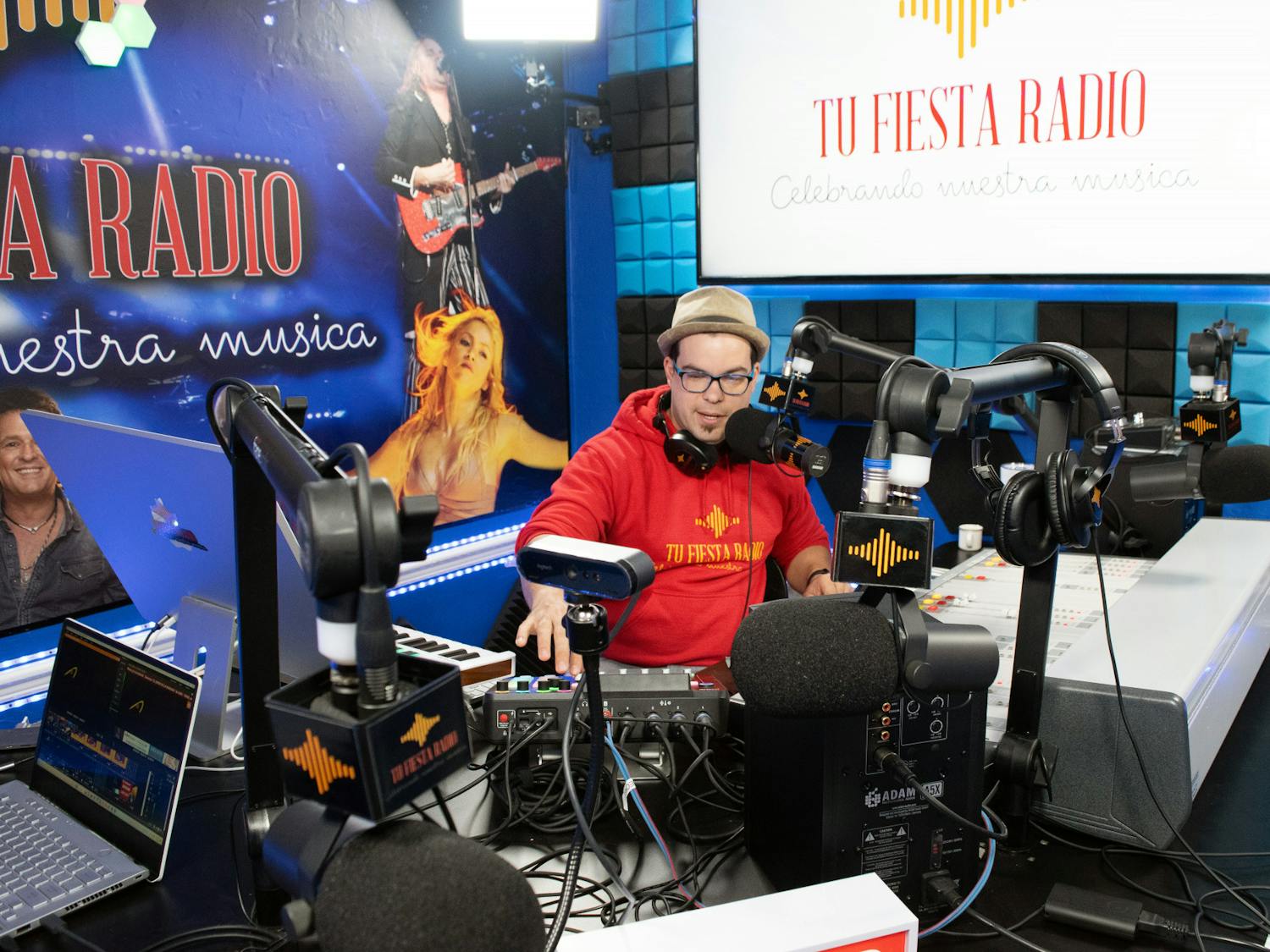 Radio host Elio Piedra announces the next song to be played to listeners of Tu Fiesta Radio Thursday, March 2, 2023. 