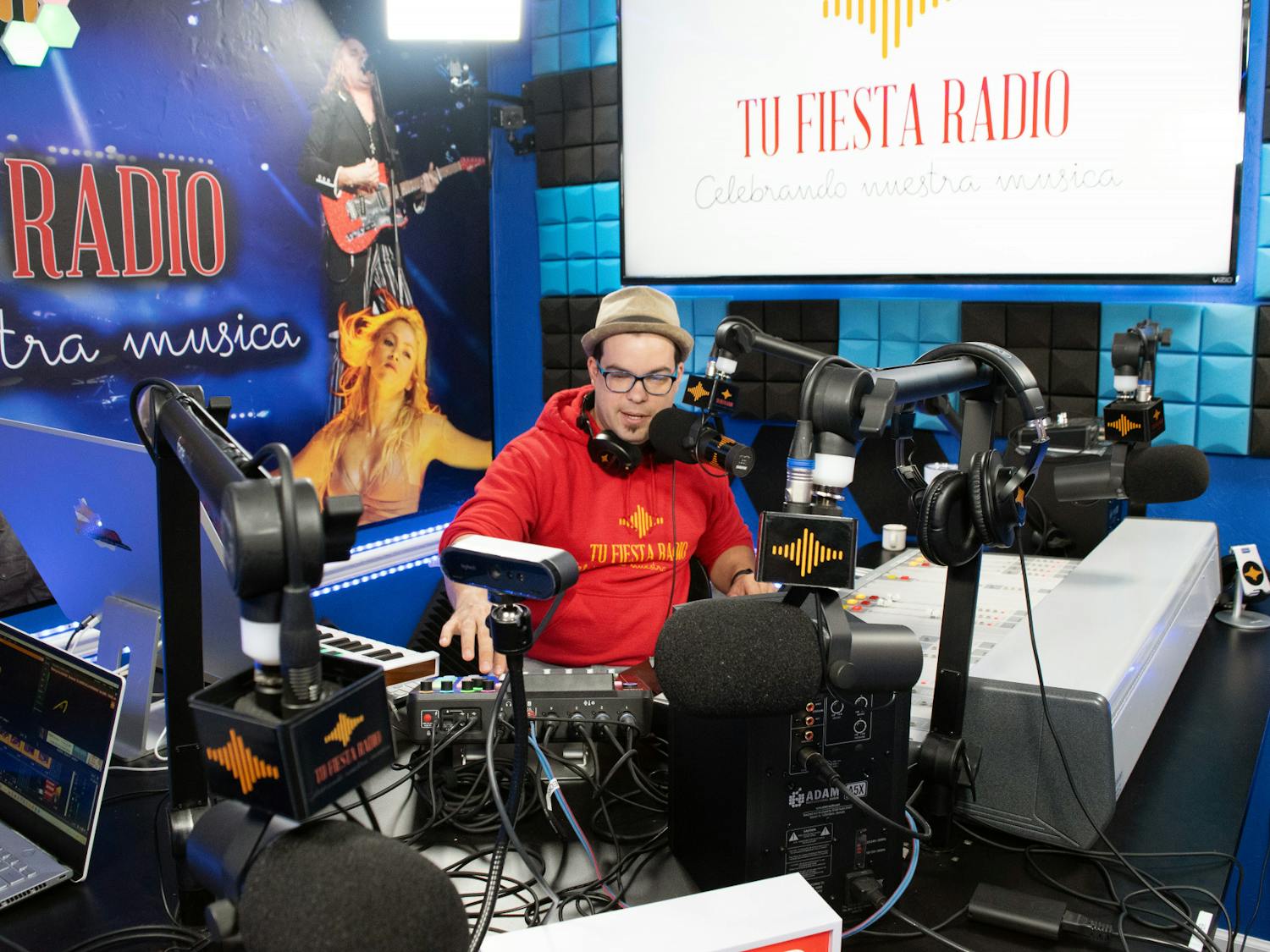 Radio host Elio Piedra announces the next song to be played to listeners of Tu Fiesta Radio Thursday, March 2, 2023.
