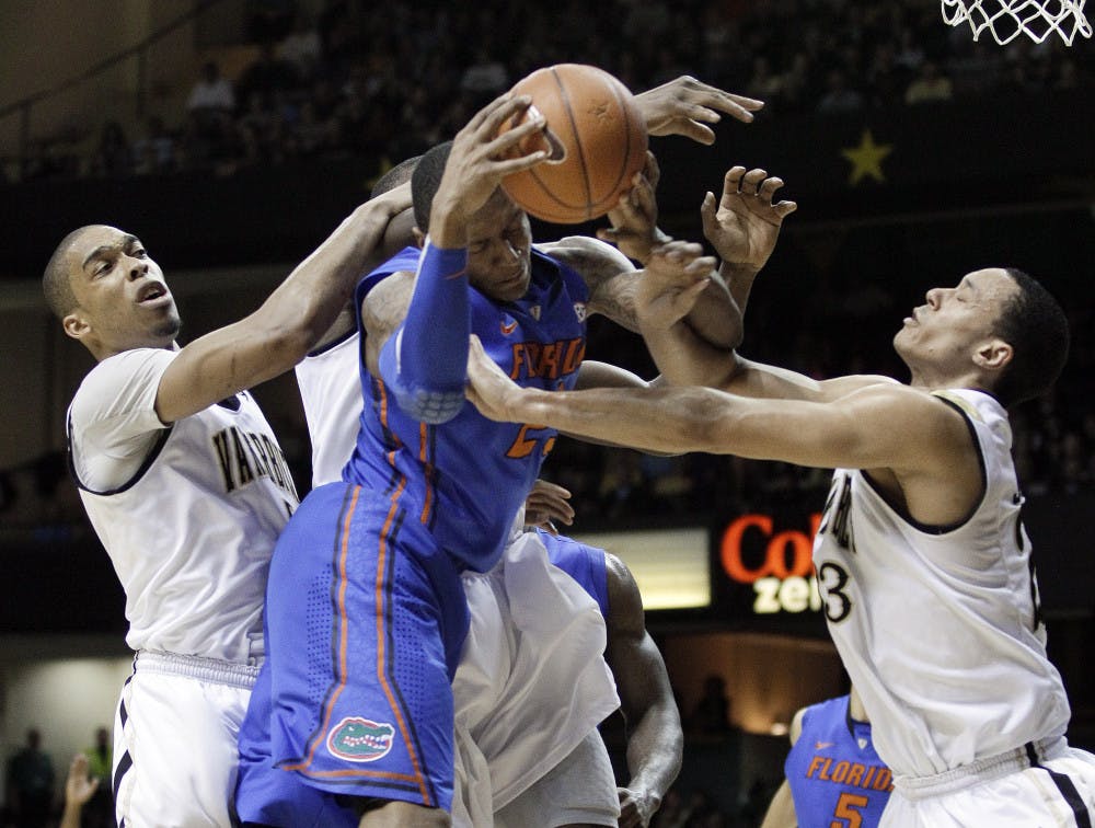 <p>Freshman UF  guard Brad Beal (center) has led the Gators in scoring (15.1 points per game) and rebounding (7.2 per game) during the second half of the season.</p>