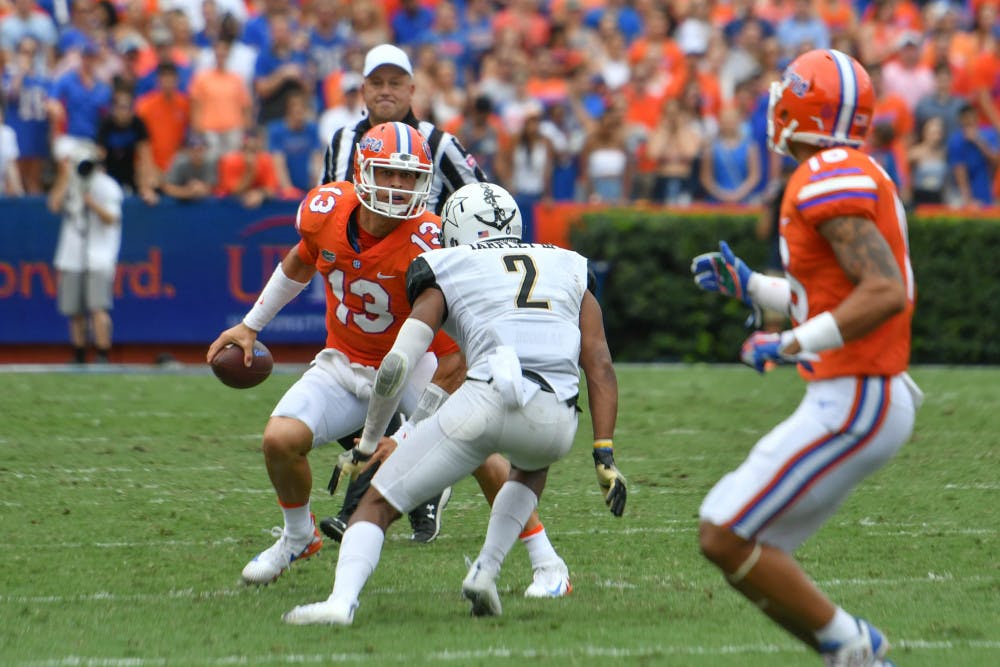 UF quarterback Feleipe Franks attempts to get past a defender during Florida's 38-24 win against Vanderbilt on Saturday at Ben Hill Griffin Stadium.
