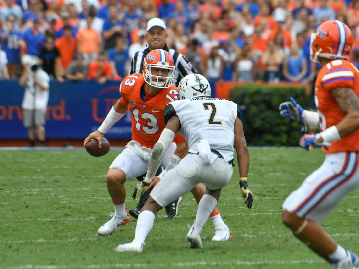 UF quarterback Feleipe Franks attempts to get past a defender during Florida's 38-24 win against Vanderbilt on Saturday at Ben Hill Griffin Stadium.