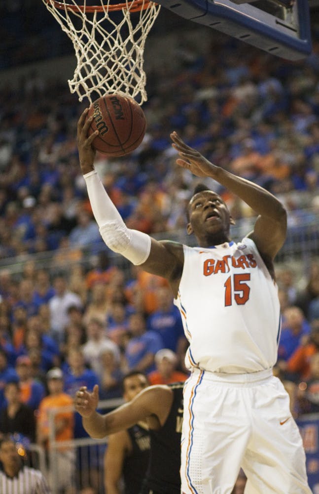 Junior forward Will Yeguete attempts a layup during Florida’s 66-40 victory against Vanderbilt on March 6 in the O’Connell Center. Yeguete underwent arthroscopic debridement on his right knee Wednesday. 