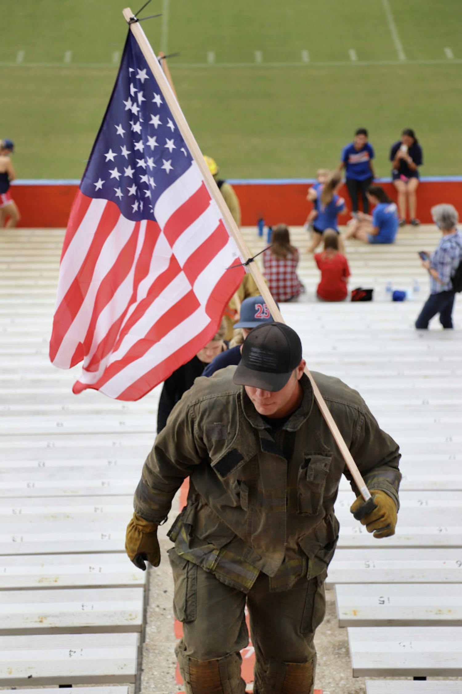 Fire Rescue workers from Alachua and surrounding counties, and their families climbed the steps at Ben Hill Griffin Stadium on Sept. 11, 2020.