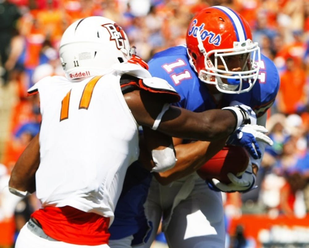 <p>Tight end Jordan Reed (11) breaks a tackle during UF's 27-14 win against Bowling Green University on Sept. 1 at Ben Hill Griffin Stadium.</p>