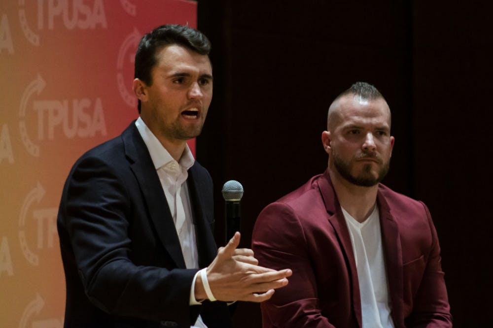 Charlie Kirk, leader of Turning Point USA,  and Graham Allen, political speaker, answer questions from an audience in University Auditorium. Kirk was one of several conservative figures to criticize UF for suspending three student groups for violating university COVID-19 policies.