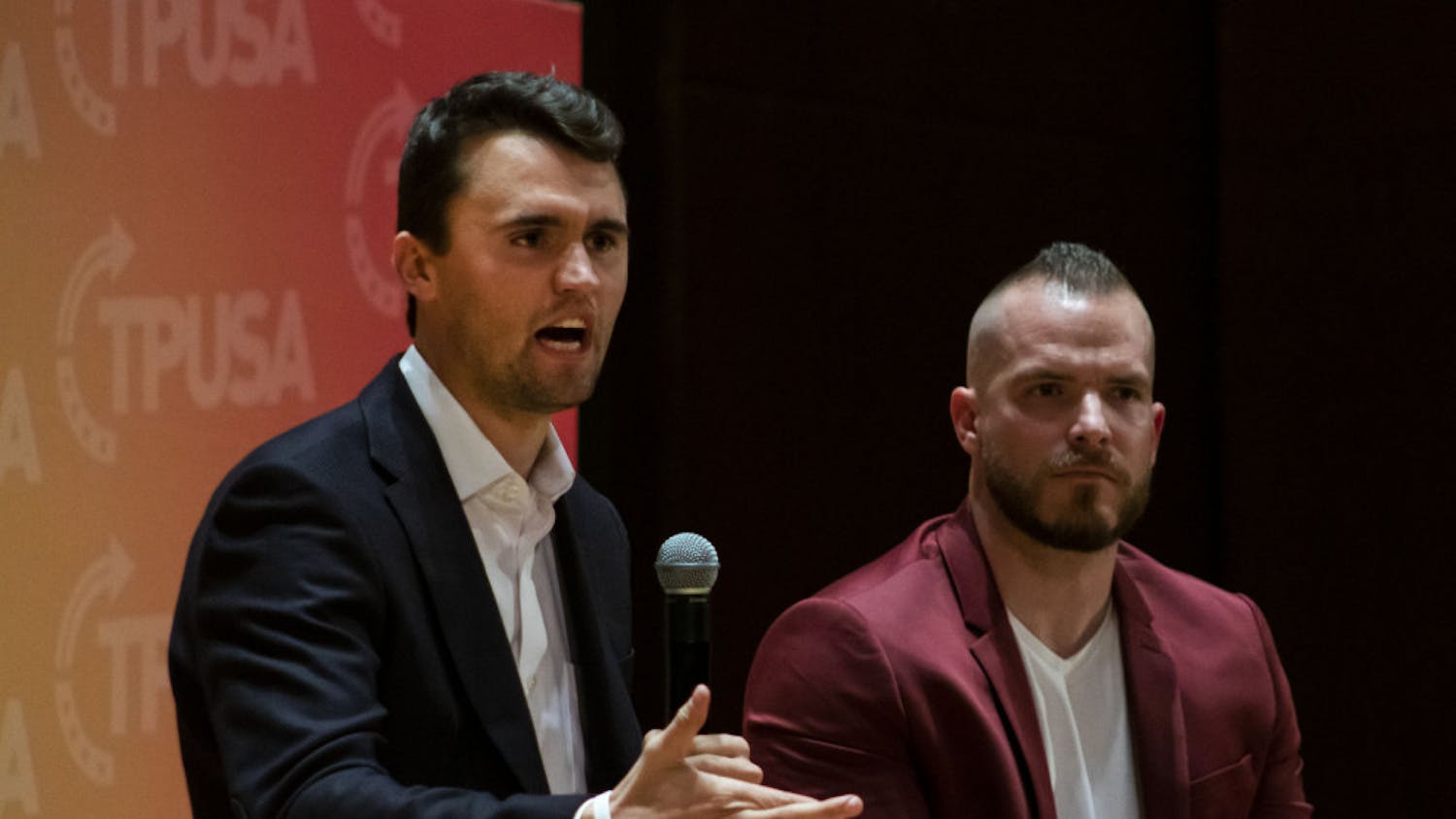 Charlie Kirk, leader of Turning Point USA,  and Graham Allen, political speaker, answer questions from an audience in University Auditorium. Kirk was one of several conservative figures to criticize UF for suspending three student groups for violating university COVID-19 policies.