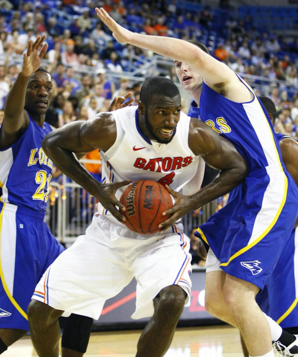 <p><span>Patric Young pulls down a rebound during Florida’s 101-71 exhibition win against Nebraska-Kearney on Thursday in the O’Connell Center.</span></p>
<div><span><br /></span></div>