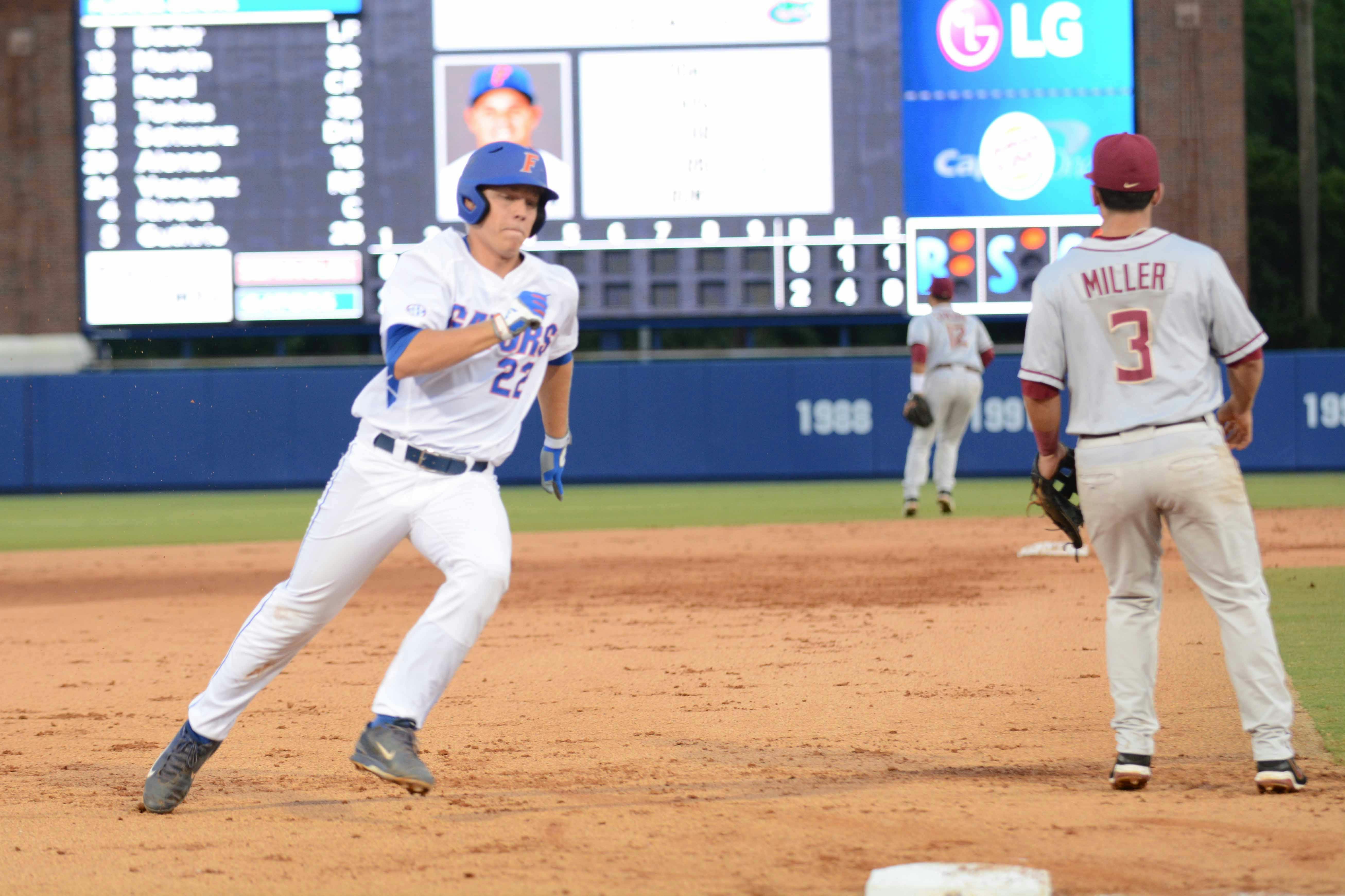 UF's JJ Schwarz runs past third base and heads to score during the first inning of Florida's 13-5 win against Florida State in the NCAA Super Regionals on June 5, 2015, at McKethan Stadium.
