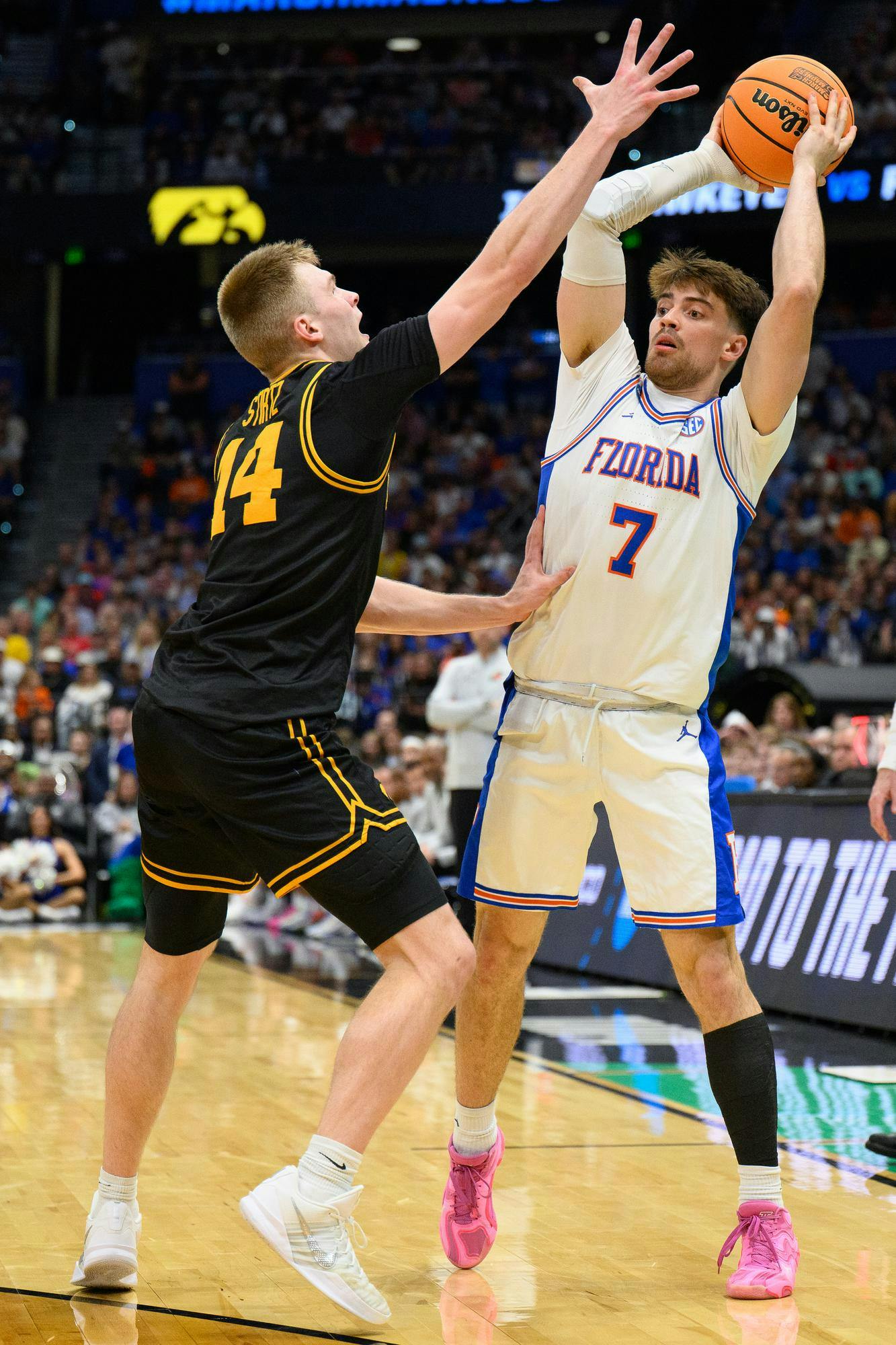 Florida guard Urban Klavzar (7) passes during the first half of an NCAA Tournament second round game against Iowa, Sunday, March 22, 2026, in Tampa, Fla.