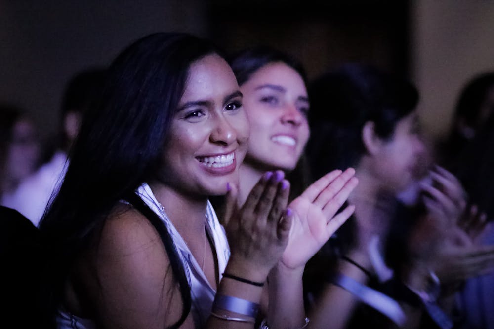 <p>Alexia Yau, a 19-year-old UF natural resource conservation junior, cheers as Julissa Calderon, a Buzzfeed video producer and the keynote speaker at the UF Hispanic-Latinx Student Assembly, concludes her presentation.</p>