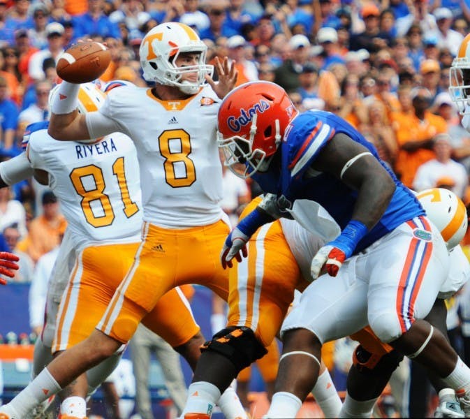 Tennessee quarterback Tyler Bray attempts a pass as Dominique Easley applies pressure during Florida's game against the Volunteers Sept. 17, 2011. The Gators travel to Knoxville to face the top-ranked passing offense in the SEC on Saturday.