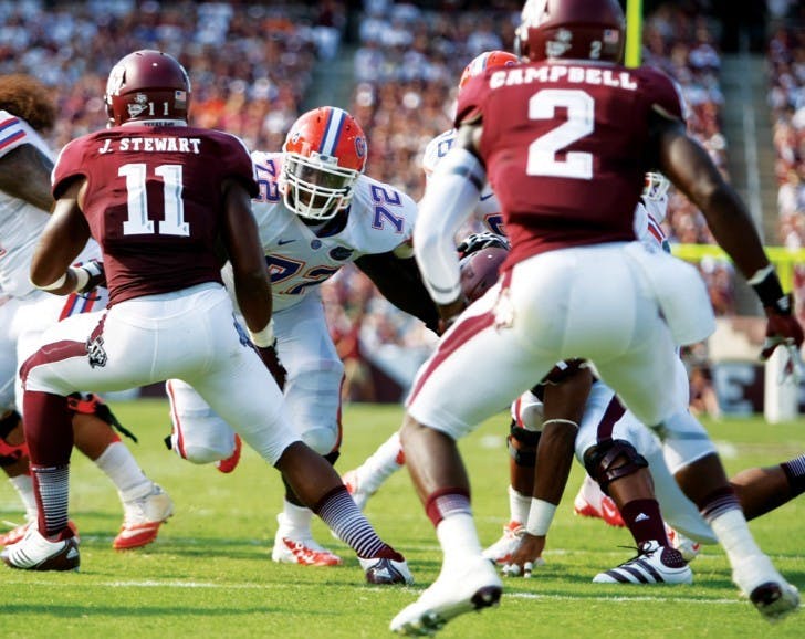 Offensive lineman Jonotthan Harrison (72) blocks for sophomore quarterback Jeff Driskel (6) during UF's 20-17 victory on Saturday against Texas A&amp;M University at Kyle Field.