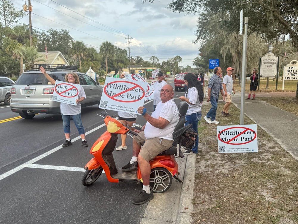 <p>A man sits on a scooter protesting against the creation of Wildflowers Music Park in Melrose, Fla., Thursday, Jan. 8, 2026.</p>