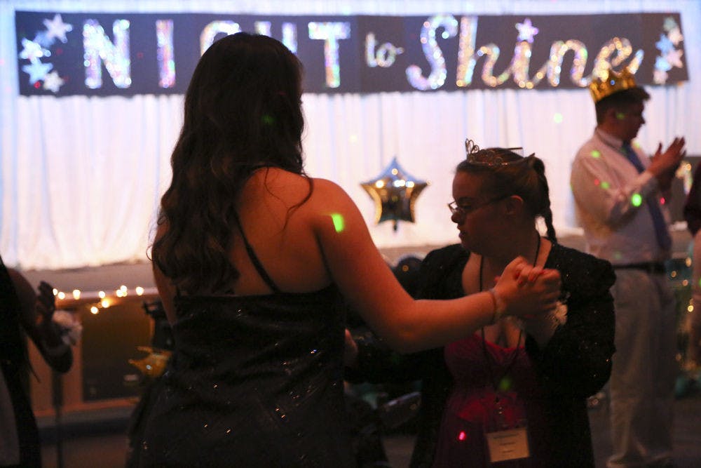 <p>Lexie Matheo, a UF health science freshman, dances with Rosemary, 19, at Night to Shine. Matheo was Rosemary’s buddy, accompanying her the entire night. “It is almost like you're not even volunteering,” Matheo said. “It’s so fulfilling.”</p>