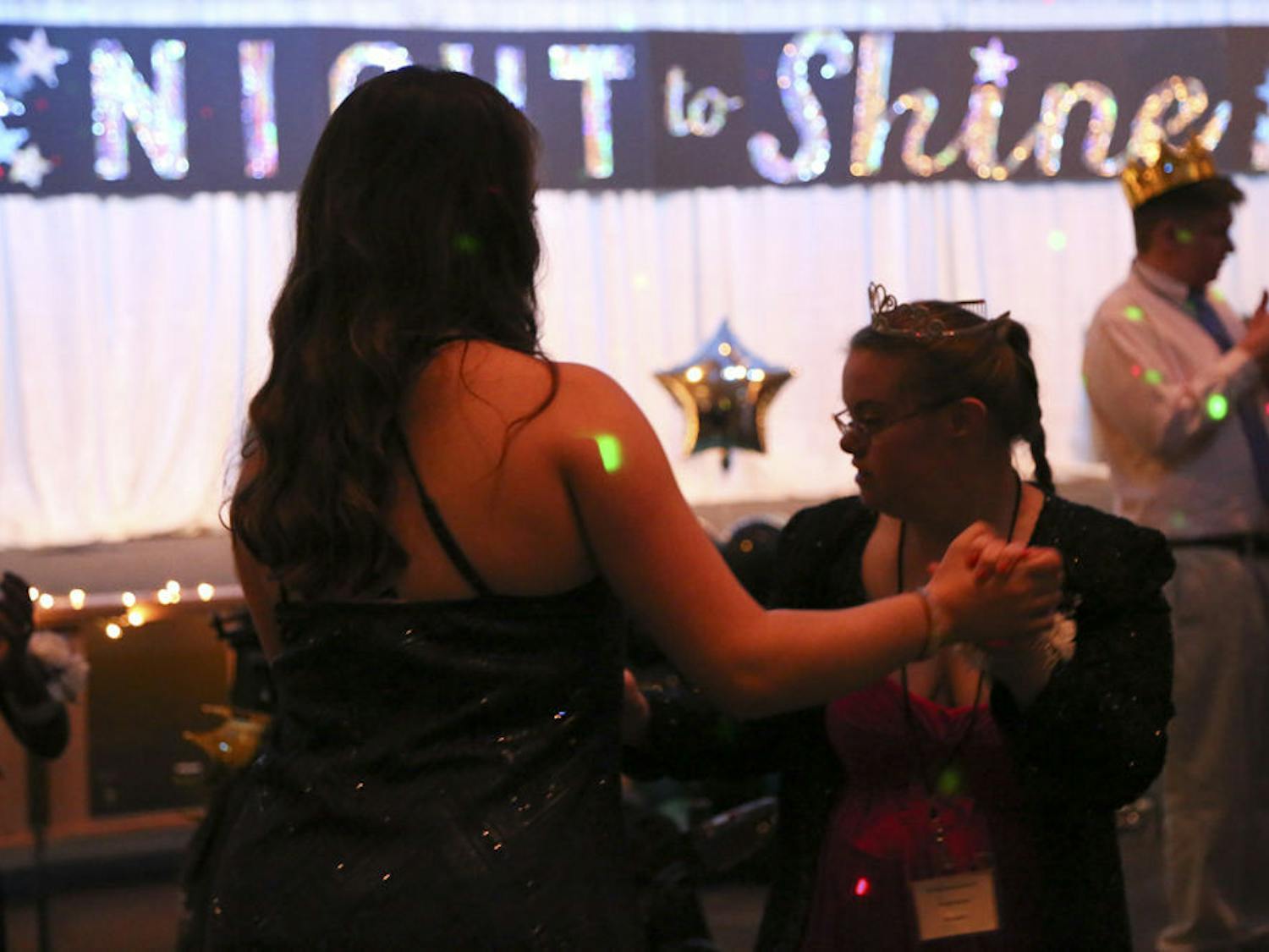 Lexie Matheo, a UF health science freshman, dances with Rosemary, 19, at Night to Shine. Matheo was Rosemary’s buddy, accompanying her the entire night. “It is almost like you're not even volunteering,” Matheo said. “It’s so fulfilling.”