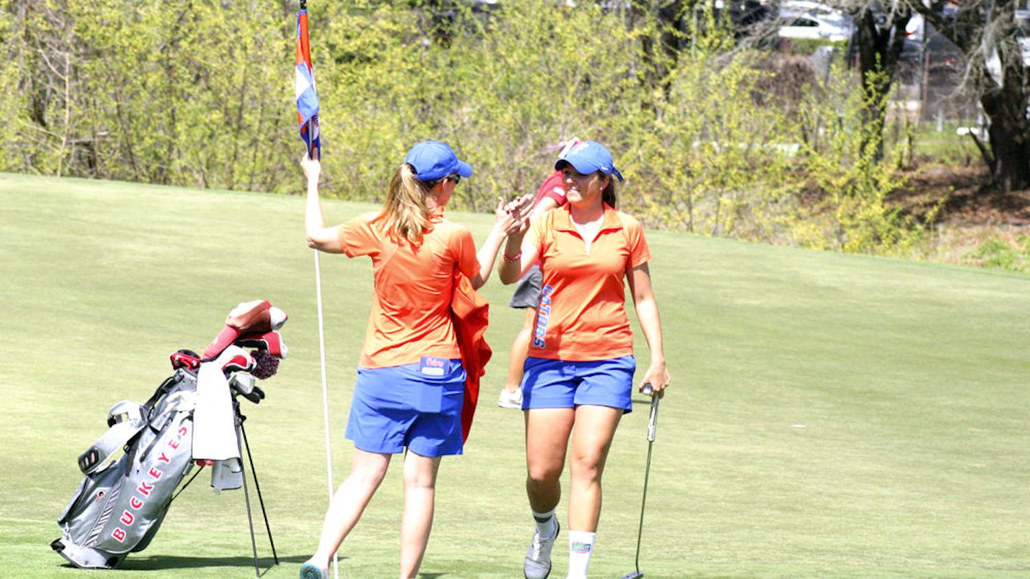 Karolina Vlckova (right) celebrates with coach Emily Glaser during the 2015 SunTrust Gator Invitational at UF's Mark Bostick Golf Course.