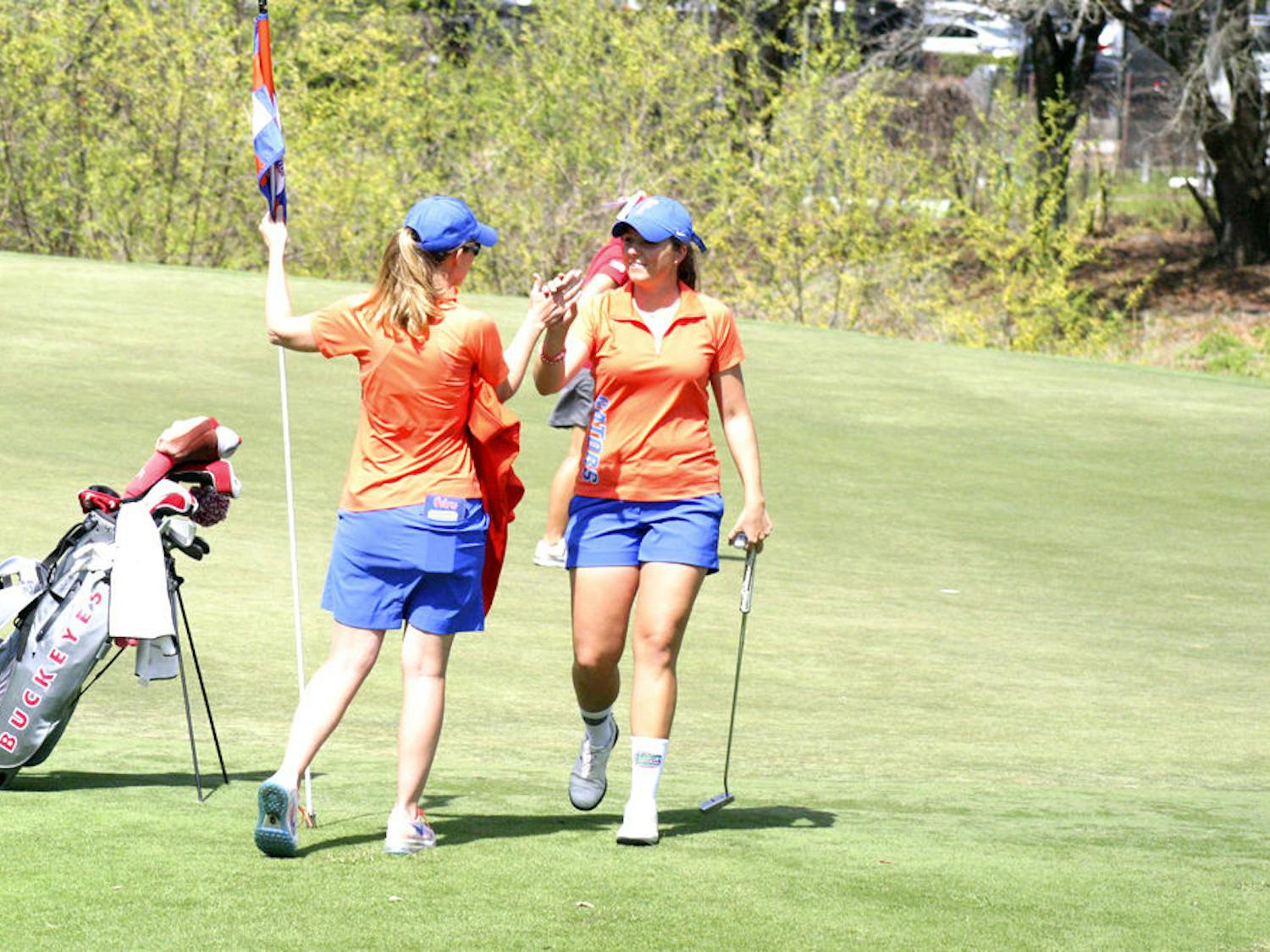 Karolina Vlckova (right) celebrates with coach Emily Glaser during the 2015 SunTrust Gator Invitational at UF's Mark Bostick Golf Course.