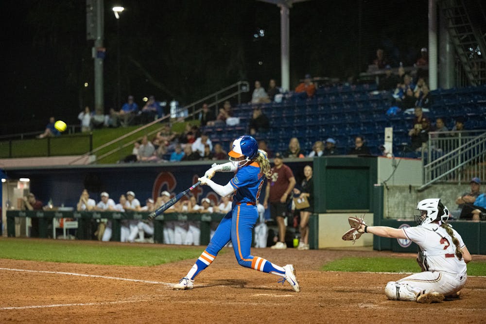 Florida Gators outfielder Taylor Shumaker (21) hits her seventh home run over nine games in a softball game against Boston College in Gainesville, Fla., on Thursday, Feb. 13, 2025.