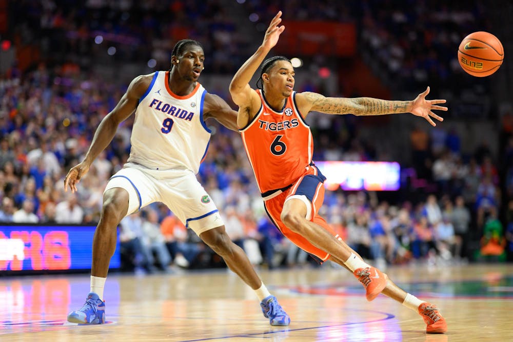<p>Florida center Rueben Chinyelu (9) forces a turnover by Auburn guard Elyjah Freeman (6) during the second half of an NCAA college basketball game against Florida, Saturday, Jan. 24, 2026, in Gainesville, Fla.</p>