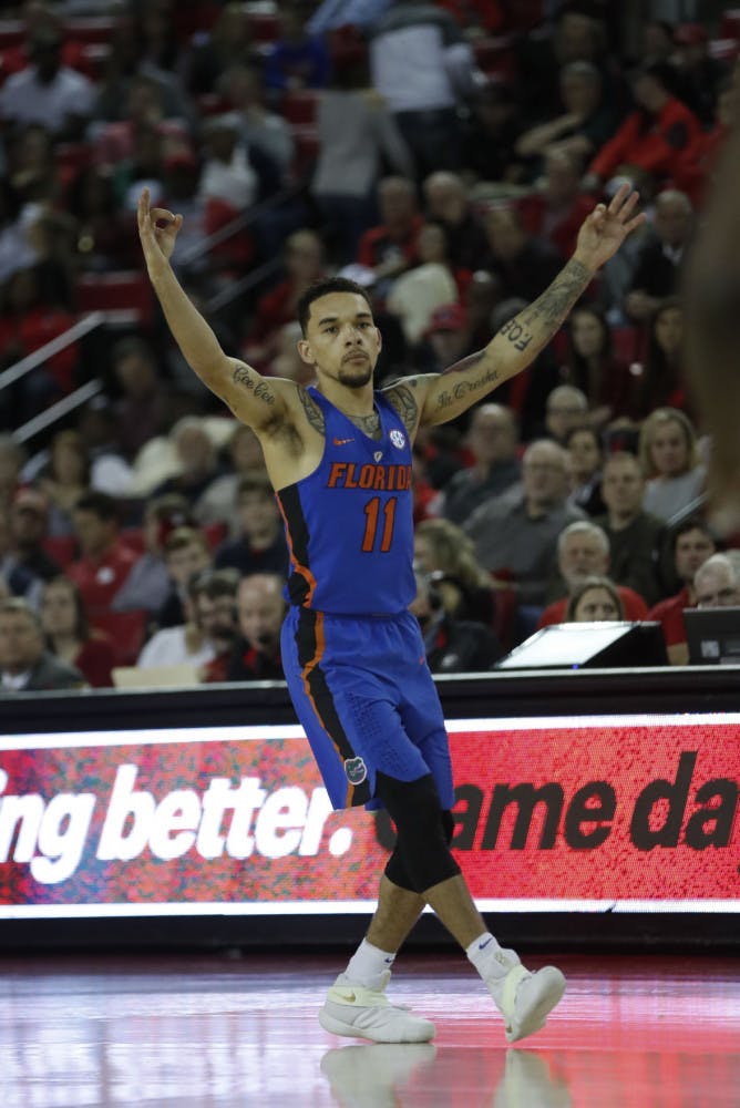 Florida guard Chris Chiozza (11) reacts after hitting a 3-point shot during the second half of the team's NCAA college basketball game against Georgia on Tuesday, Feb. 7, 2017, in Athens, Ga. Florida won 72-60. (AP Photo/John Bazemore)