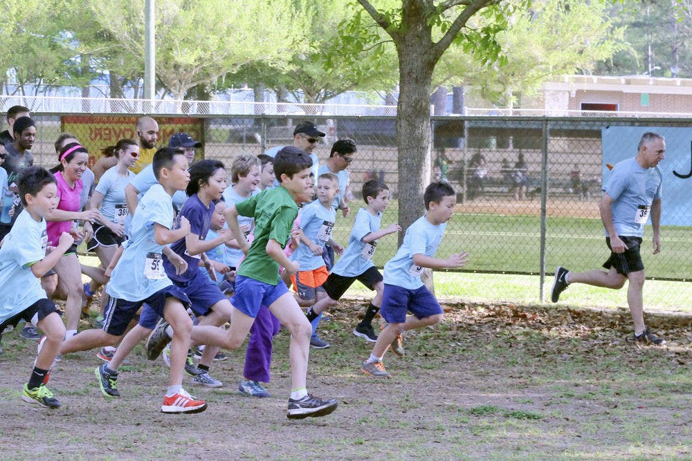 Talbot Elementary School students and Gainesville community members begin running during Joey’s Run Saturday morning at Westside Recreation Center. The run was hosted by Joey’s Wings Foundation in memory of 10-year-old Joey Xu, who passed away from a rare form of kidney cancer in November.