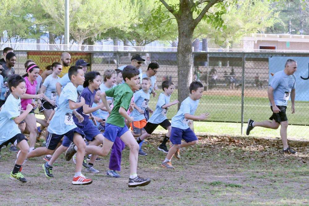 <p>Talbot Elementary School students and Gainesville community members begin running during Joey’s Run Saturday morning at Westside Recreation Center. The run was hosted by Joey’s Wings Foundation in memory of 10-year-old Joey Xu, who passed away from a rare form of kidney cancer in November.</p>