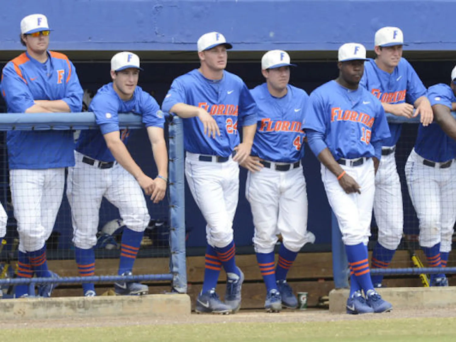 Several members of the Gators baseball team stand on the top steps of the dugout during Florida’s 4-0 win against Ole Miss on March 31 at McKethan Stadium. Florida dropped the final game of its series against Tennessee 4-2 on Sunday.